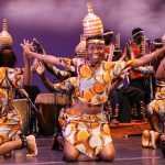 Ugandan cultural dancers performing a traditional dance