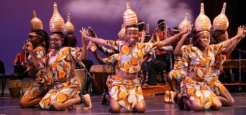 Ugandan cultural dancers performing a traditional dance